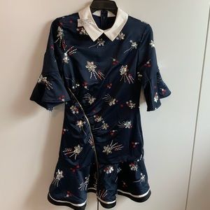 Navy dress with white collar with star and burst design.  3/4 bell ruffle sleeve